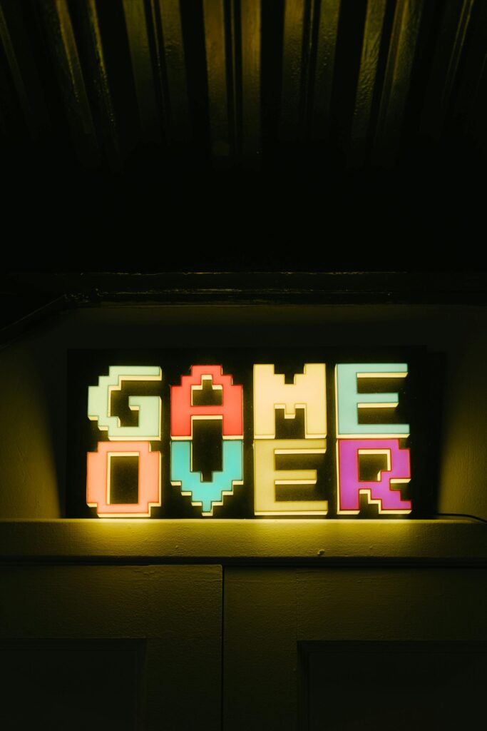 pexels-photo-4835419-4835419 Bright neon 'Game Over' sign in retro style, perfect for gaming nostalgia